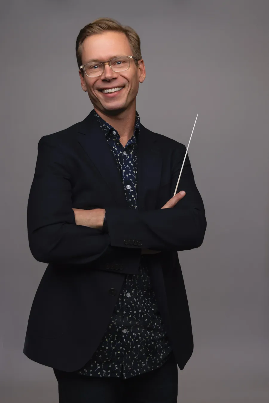 Edward Leonard posing with a conductor's baton